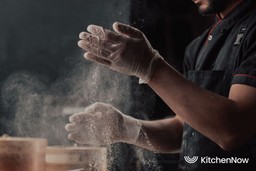 chef-preparing-chinese-dumpling-in-kitchen-