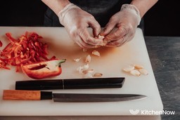 asian-chef-removing-seed-from-bell-pepper